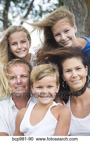 Portrait of a family of five on a windy day View Large Photo Image Stock Image - Portrait of a family of five on a windy day. Fotosearch