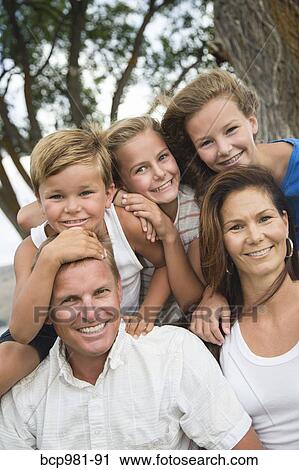 Portrait of a family of five on a windy day View Large Photo Image Stock Image - Portrait of a family of five on a windy day. Fotosearch