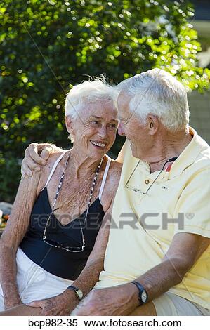 Portrait of a senior couple sitting outdoors View Large Photo Image Stock Photography - Portrait of a senior couple sitting outdoors. Fotosearch