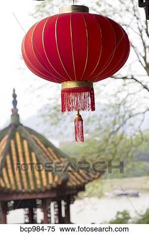 "Red lantern hanging in front of a temple, Yangshuo, China" View Large Photo Image Stock Photography - "Red lantern hanging in front of a temple, Yangshuo, China". Fotosearch