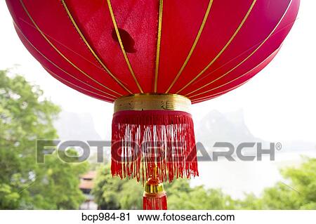 "Red lantern hanging in front of the Li River, Yangshuo, China" View Large Photo Image Stock Image - "Red lantern hanging in front of the Li River, Yangshuo, China". Fotosearch