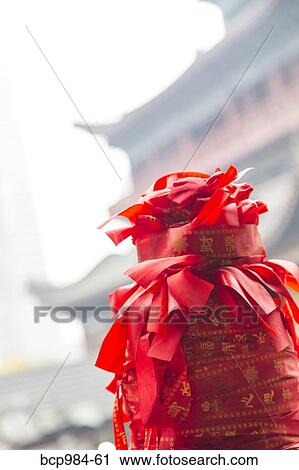 "Red ribbons tied to a stone post in front of an ancient temple, Chongqing, China" View Large Photo Image Stock Image - "Red ribbons tied to a stone post in front of an ancient temple, Chongqing, China". Fotosearch