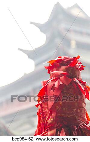 "Red ribbons tied to a stone post in front of an ancient temple, Chongqing, China" View Large Photo Image Stock Image - "Red ribbons tied to a stone post in front of an ancient temple, Chongqing, China". Fotosearch