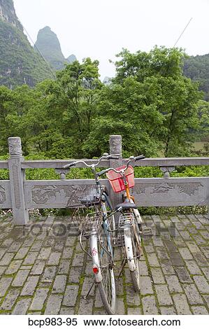 Stock Photography - "Rental bicycles in a hotel courtyard, Yangshuo, China". Fotosearch