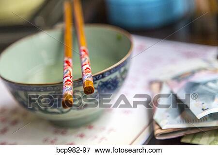 Soup bowl and chopsticks at a Chinese restaurant View Large Photo Image Stock Photo - Soup bowl and chopsticks at a Chinese restaurant. Fotosearch