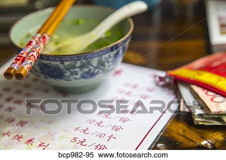 Soup bowl and chopsticks at a Chinese restaurant View Large Photo Image Stock Photography - Soup bowl and chopsticks at a Chinese restaurant. Fotosearch
