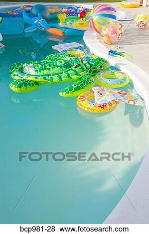 Swimming pool full of inflatable toys View Large Photo Image Stock Photo - Swimming pool full of inflatable toys. Fotosearch