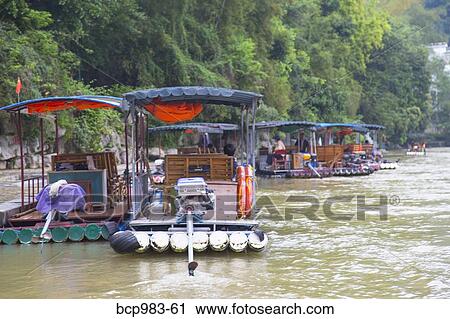 "Tourists on bamboo rafts on the Li River, Yangshuo, China" View Large Photo Image Stock Image - "Tourists on bamboo rafts on the Li River, Yangshuo, China". Fotosearch