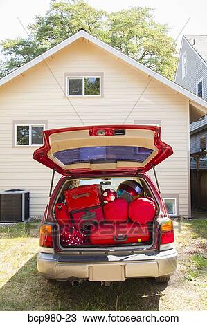 Trunk of a car packed with luggage View Large Photo Image Stock Image - Trunk of a car packed with luggage. Fotosearch