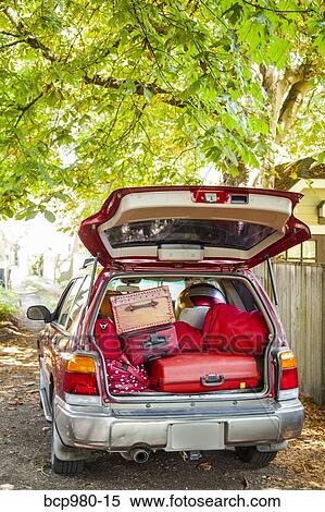 Stock Photography - Trunk of a car packed with luggage. Fotosearch