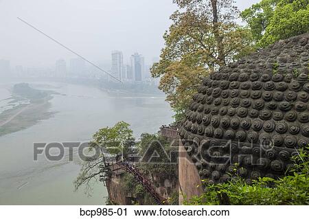 "View of a river and distant city from the head of the Leshan giant Buddha, Sichuan province, China" View Large Photo Image Stock Image - "View of a river and distant city from the head of the Leshan giant Buddha, Sichuan province, China". Fotosearch