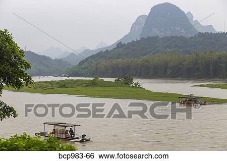 "View of bamboo rafts on the Li River from the temple, Yangshuo, China" View Large Photo Image Stock Photograph - "View of bamboo rafts on the Li River from the temple, Yangshuo, China". Fotosearch