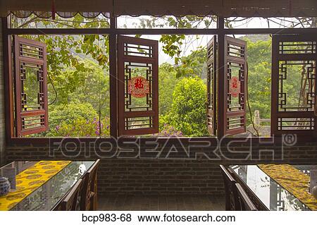 "View of mountains from inside a restaurant, Yangshuo, China" View Large Photo Image Stock Photo - "View of mountains from inside a restaurant, Yangshuo, China". Fotosearch