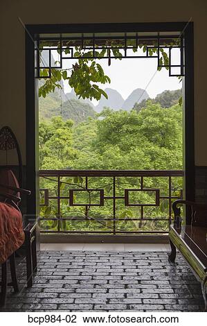 "View of the Karst mountains from a hotel interior, Yangshuo, China" View Large Photo Image Stock Image - "View of the Karst mountains from a hotel interior, Yangshuo, China". Fotosearch
