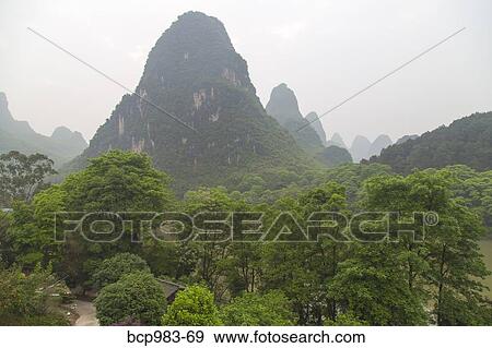 "View of the Karst mountains, Yangshuo, China" View Large Photo Image Stock Photo - "View of the Karst mountains, Yangshuo, China". Fotosearch