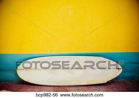 "Vintage surfboard against a colorful, striped wall" View Large Photo Image Stock Photograph - "Vintage surfboard against a colorful, striped wall". Fotosearch