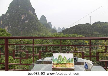 "Watercolor materials on a patio overlooking the Karst mountains, Yangshuo, China" View Large Photo Image Stock Image - "Watercolor materials on a patio overlooking the Karst mountains, Yangshuo, China". Fotosearch