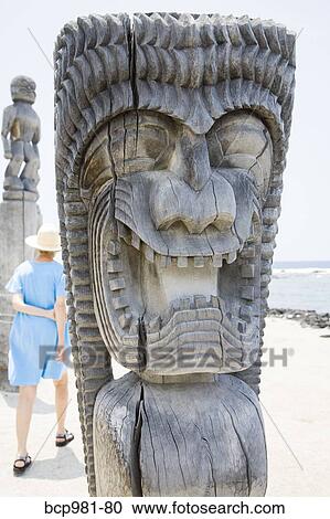 "Woman walking among carved wooden ki'i, Place of Refuge, Hawaii" View Large Photo Image Stock Image - "Woman walking among carved wooden ki'i, Place of Refuge, Hawaii". Fotosearch