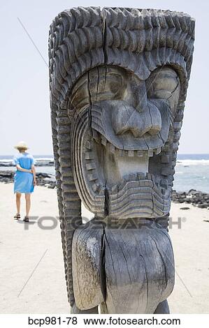"Woman walking among carved wooden ki'i, Place of Refuge, Hawaii" View Large Photo Image Stock Photo - "Woman walking among carved wooden ki'i, Place of Refuge, Hawaii". Fotosearch