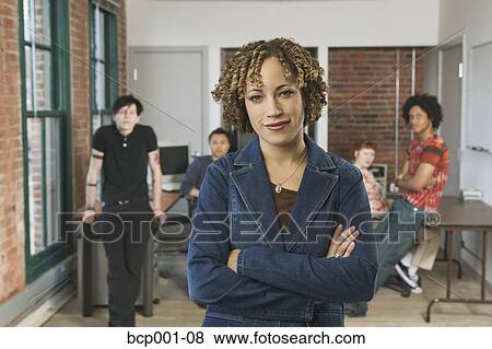 A dreadlocked woman and her office co-workers. View Large Photo Image Stock Photo - A dreadlocked woman and her office co-workers.. Fotosearch