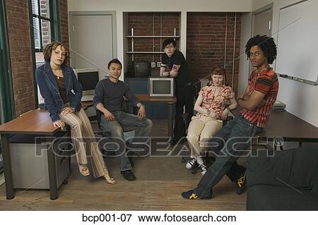 A group of twentysomething workers in a hip, loft-style office. View Large Photo Image Stock Photo - A group of twentysomething workers in a hip, loft-style office.. Fotosearch