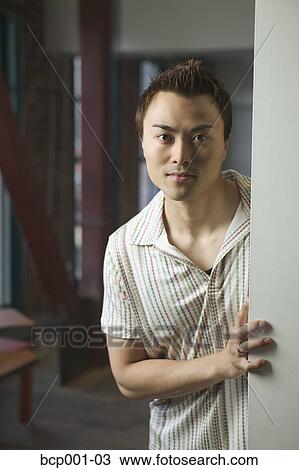 Casually dressed man in loft-style office doorway. View Large Photo Image Stock Image - Casually dressed man in loft-style office doorway.. Fotosearch