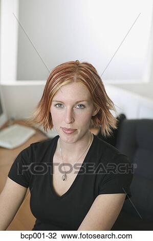 Portrait of a young, red-haired businesswoman. View Large Photo Image Stock Image - Portrait of a young, red-haired businesswoman.. Fotosearch