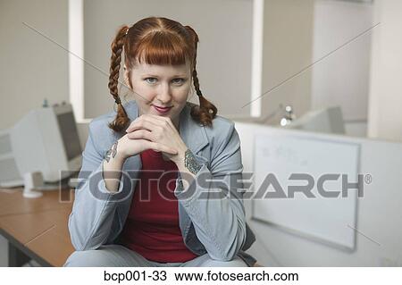 Portrait of a young, red-haired businesswoman. View Large Photo Image Stock Image - Portrait of a young, red-haired businesswoman.. Fotosearch