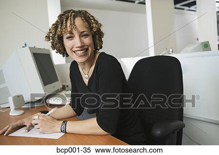 Portrait of a young, smiling businesswoman. View Large Photo Image Stock Photography - Portrait of a young, smiling businesswoman.. Fotosearch