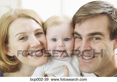 Close-up portrait of a mother, baby, and father. View Large Photo Image Stock Photo - Close-up portrait of a mother, baby, and father. . Fotosearch