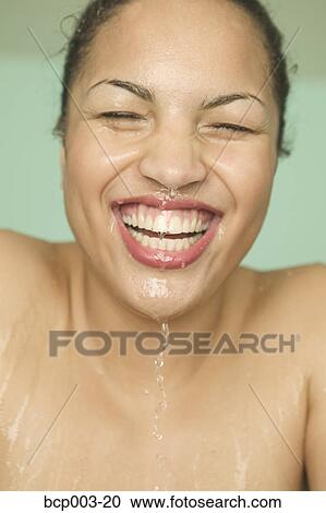 Close-up of a woman with a wet face. View Large Photo Image Stock Image - Close-up of a woman with a wet face.. Fotosearch