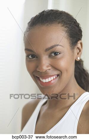 Portrait of a smiling young woman. View Large Photo Image Stock Photo - Portrait of a smiling young woman.. Fotosearch
