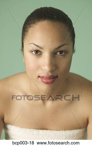 Portrait of a woman with her hair pulled back tight. View Large Photo Image Stock Photo - Portrait of a woman with her hair pulled back tight.. Fotosearch
