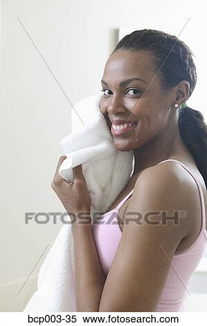 Woman drying her face with a towel. View Large Photo Image Stock Photography - Woman drying her face with a towel.. Fotosearch