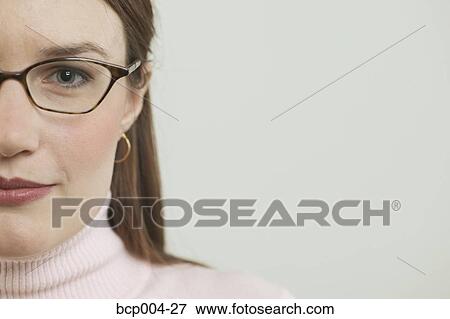 A young woman wearing glasses. View Large Photo Image Stock Photo - A young woman wearing glasses. . Fotosearch