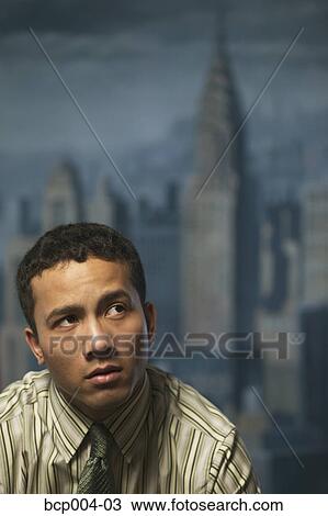 Stock Image - Portrait of a young businessperson.. Fotosearch