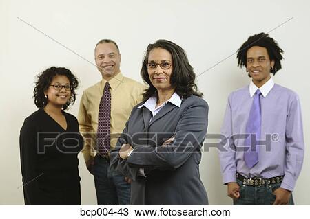 Studio portrait of four business colleagues. View Large Photo Image Stock Image - Studio portrait of four business colleagues.. Fotosearch