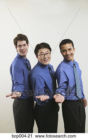 Studio portrait of three businessmen in blue shirts. View Large Photo Image Stock Image - Studio portrait of three businessmen in blue shirts. . Fotosearch