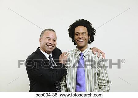 Two businessmen: one older, one younger. View Large Photo Image Stock Photograph - Two businessmen: one older, one younger.. Fotosearch