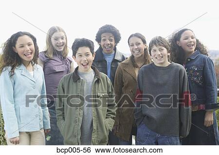 A group of teenage kids outdoors. View Large Photo Image Stock Photograph - A group of teenage kids outdoors. . Fotosearch