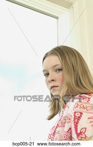 A serious teenage girl. View Large Photo Image Stock Image - A serious teenage girl. . Fotosearch