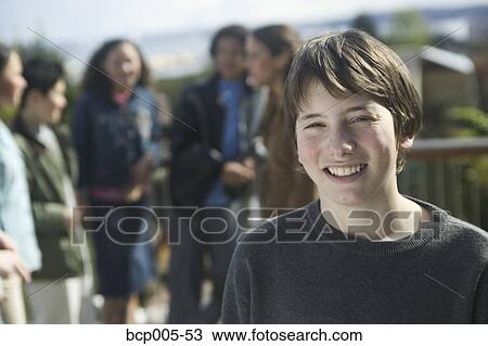 Stock Image - Outdoor portrait of a teenage boy.. Fotosearch