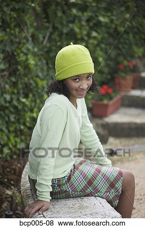 Stock Photo - Portrait of a young girl in school clothes. . Fotosearch