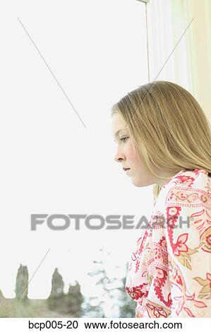 Profile of a teenage girl looking out a window. View Large Photo Image Stock Image - Profile of a teenage girl looking out a window. . Fotosearch