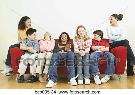 Seven teenage kids hanging out together. View Large Photo Image Picture - Seven teenage kids hanging out together. . Fotosearch