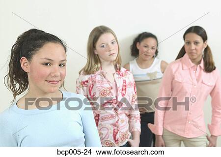Studio portrait of four teenage girls. View Large Photo Image Picture - Studio portrait of four teenage girls. . Fotosearch