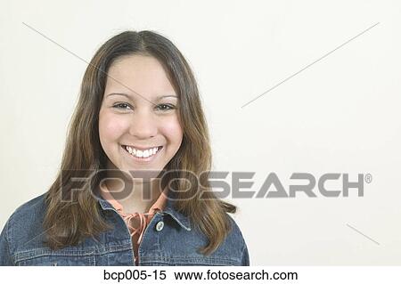 Studio portrait of young Hispanic teenage girl, smiling. View Large Photo Image Stock Photography - Studio portrait of young Hispanic teenage girl, smiling. . Fotosearch