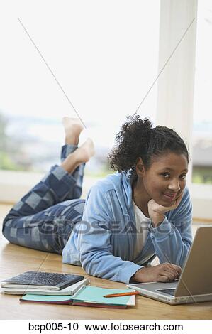 Teenage girl working on a laptop computer. View Large Photo Image Stock Image - Teenage girl working on a laptop computer. . Fotosearch