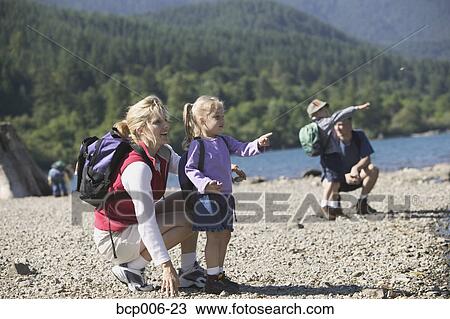 Stock Image - Family on a summer hike.. Fotosearch