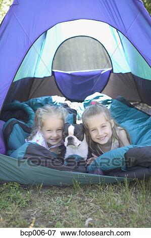 Sisters and dog in a tent. View Large Photo Image Stock Photo - Sisters and dog in a tent.. Fotosearch